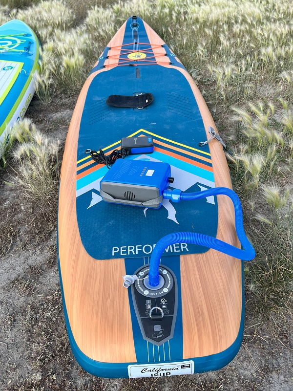 The iRocker Electric Pump is connected to the BodyGlove Performer SUP